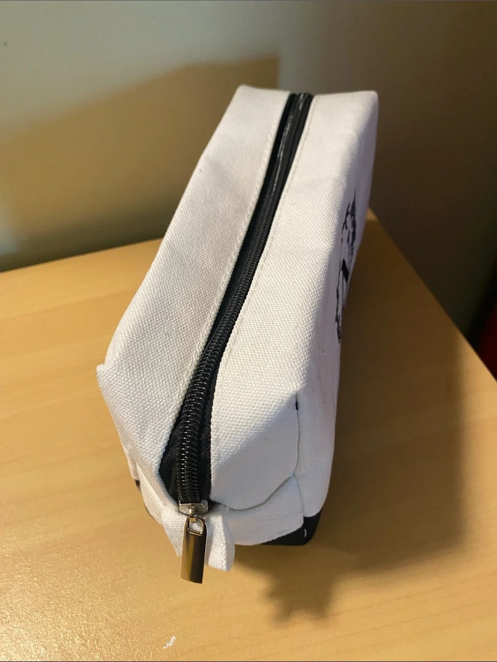 Initial N black and white lined toiletry bag